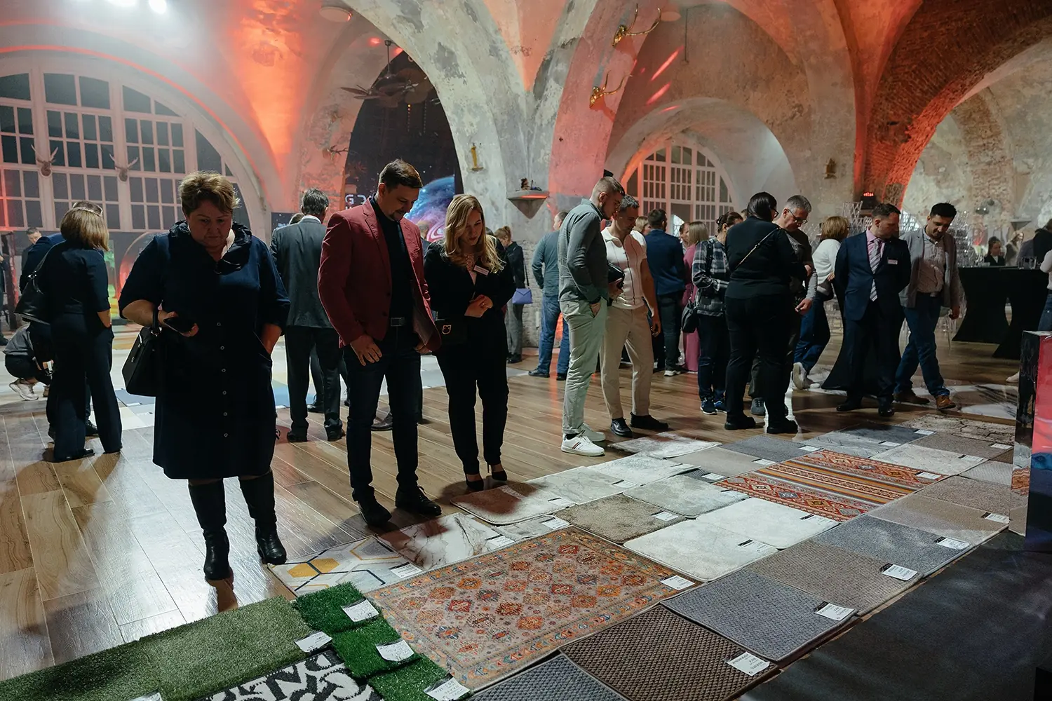 Guests exploring flooring collections in the BIG DAY NEW ERA exhibition environment