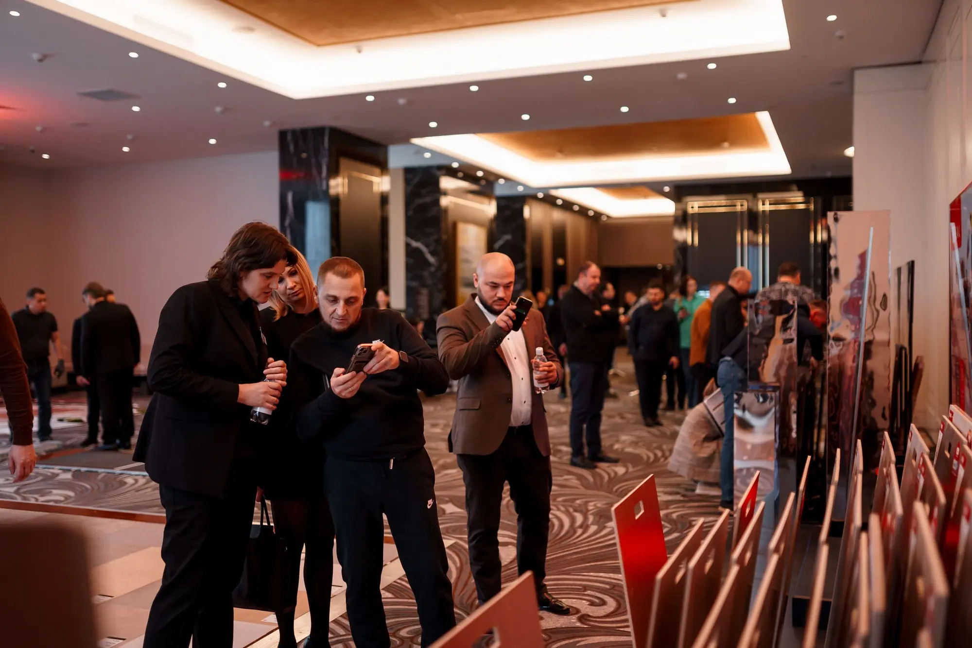 Guests reviewing product displays at the BIG DAY NEW ERA exhibition